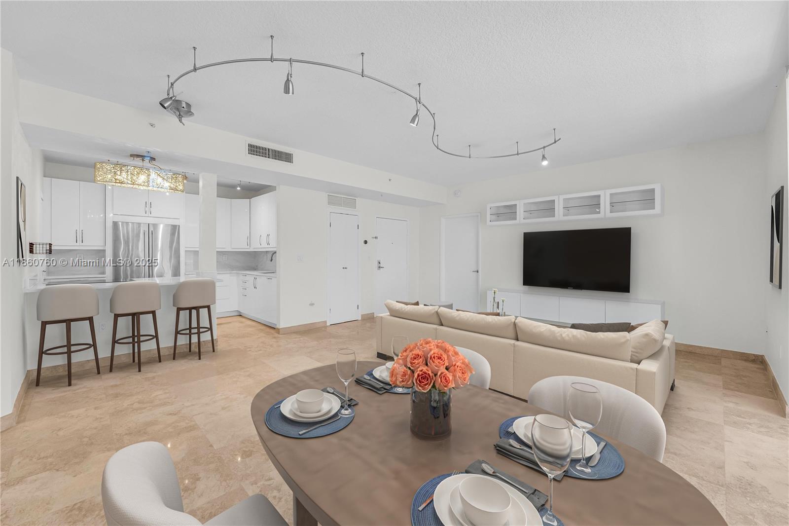 1 Century Lane, Unit 202 Miami Beach, FL 33139 - Photo 3 of 28 a living room with furniture and a flat screen tv