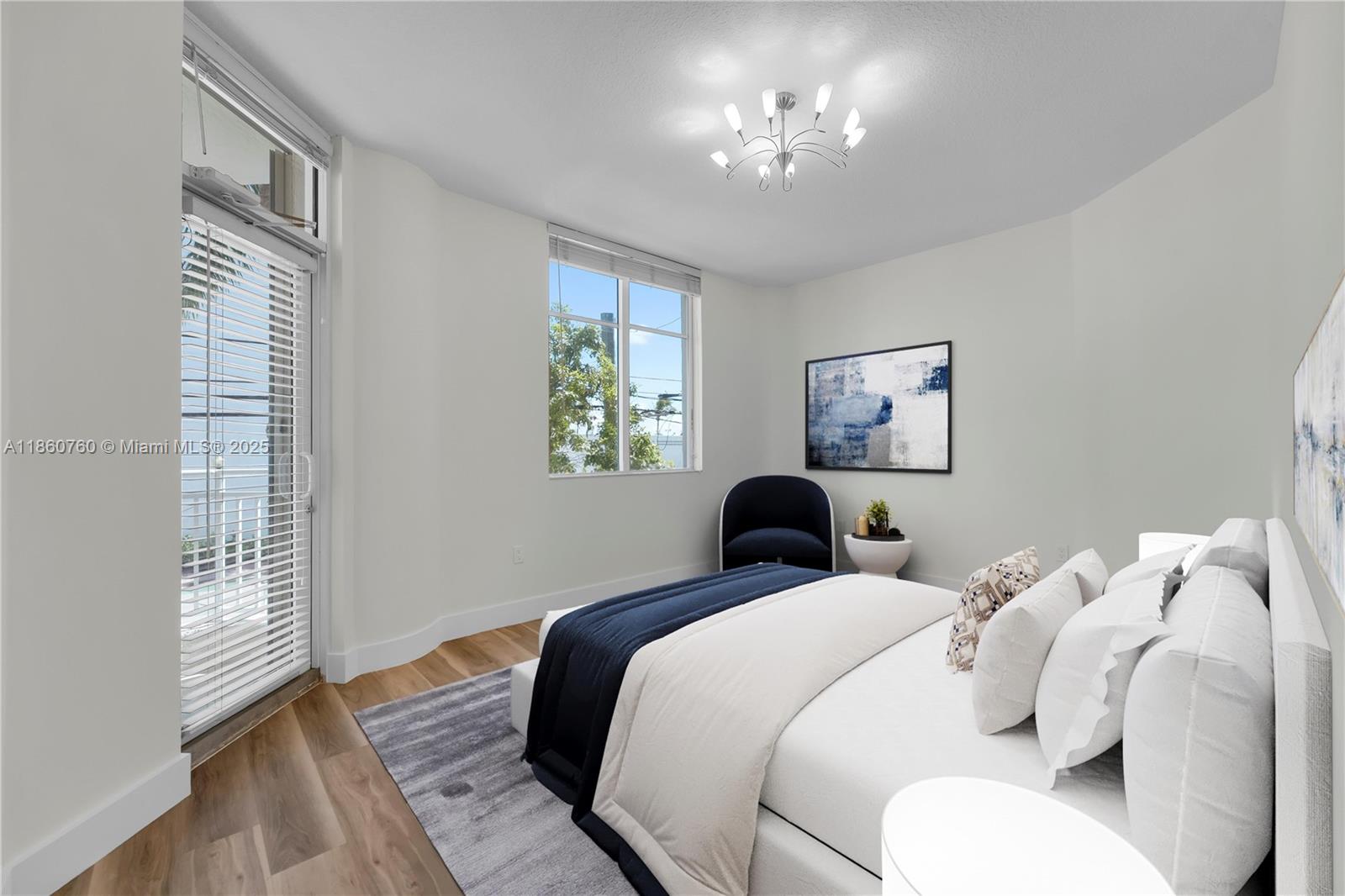1 Century Lane, Unit 202 Miami Beach, FL 33139 - Photo 5 of 28 a bedroom with bed and a window