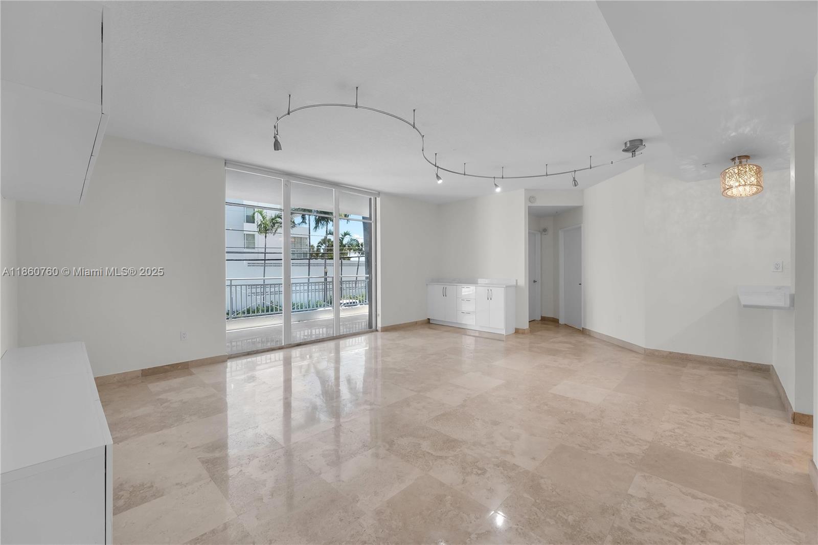 1 Century Lane, Unit 202 Miami Beach, FL 33139 - Photo 6 of 28 a view of an empty room with a window