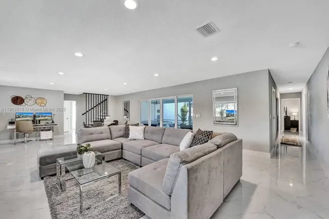 a view of a dining room with furniture window and outside view