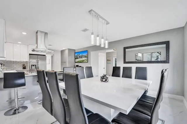 a bedroom with a bed a large window with outer view and glass windows