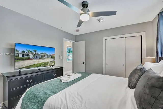 a bedroom with a bed and a walk in closet