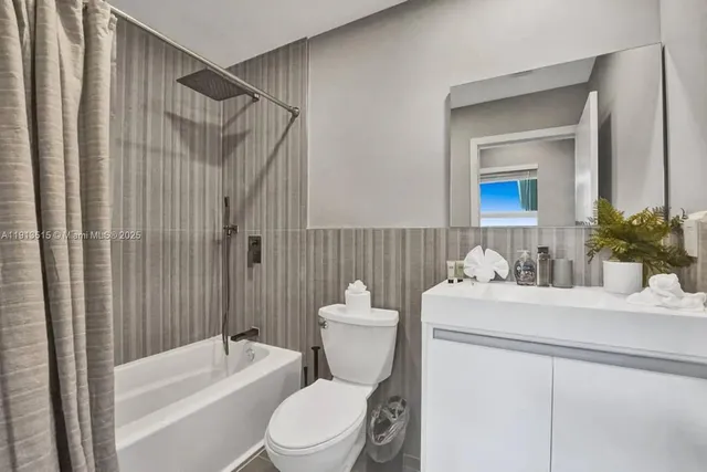 a bedroom with double bed and a window