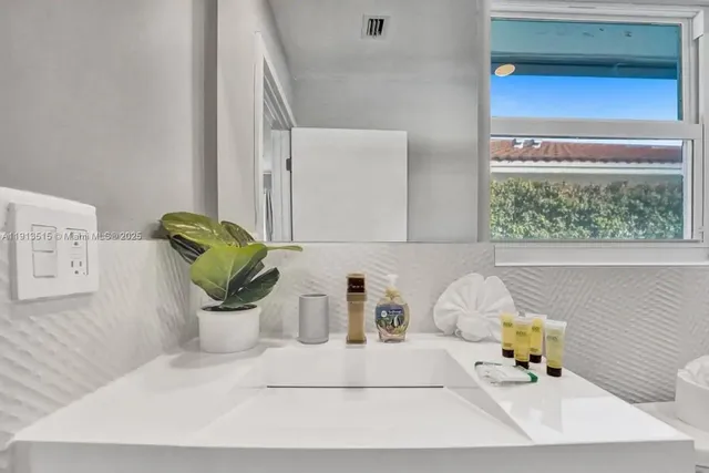 an aerial view of multiple houses with yard