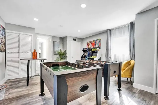 an aerial view of a house with swimming pool garden and patio