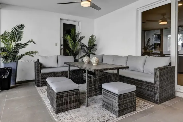 an aerial view of residential houses with outdoor space and street view