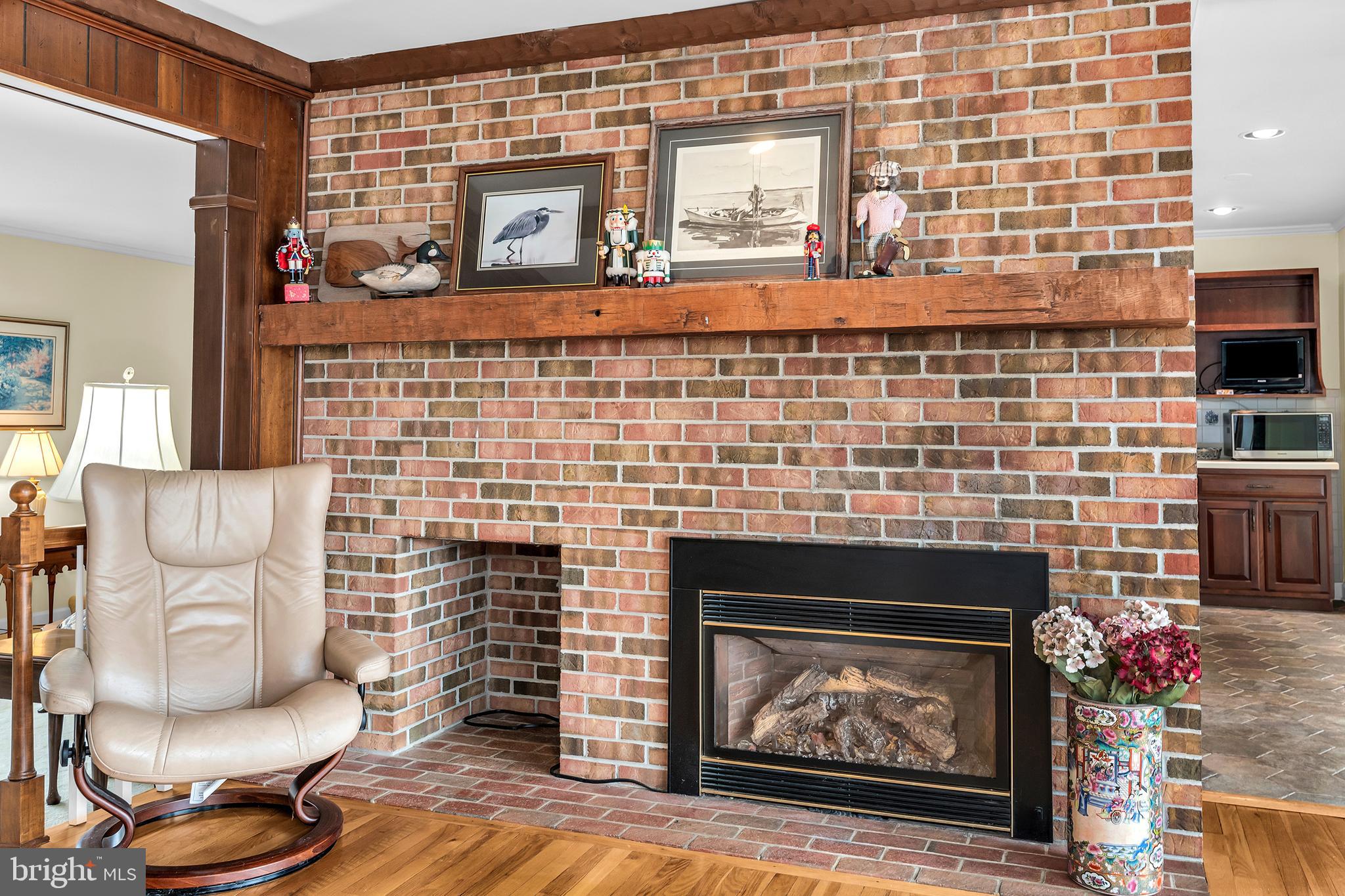 4752 Sailors Retreat Road Oxford, MD 21654 - Photo 14 of 22 a living room with furniture and a fireplace