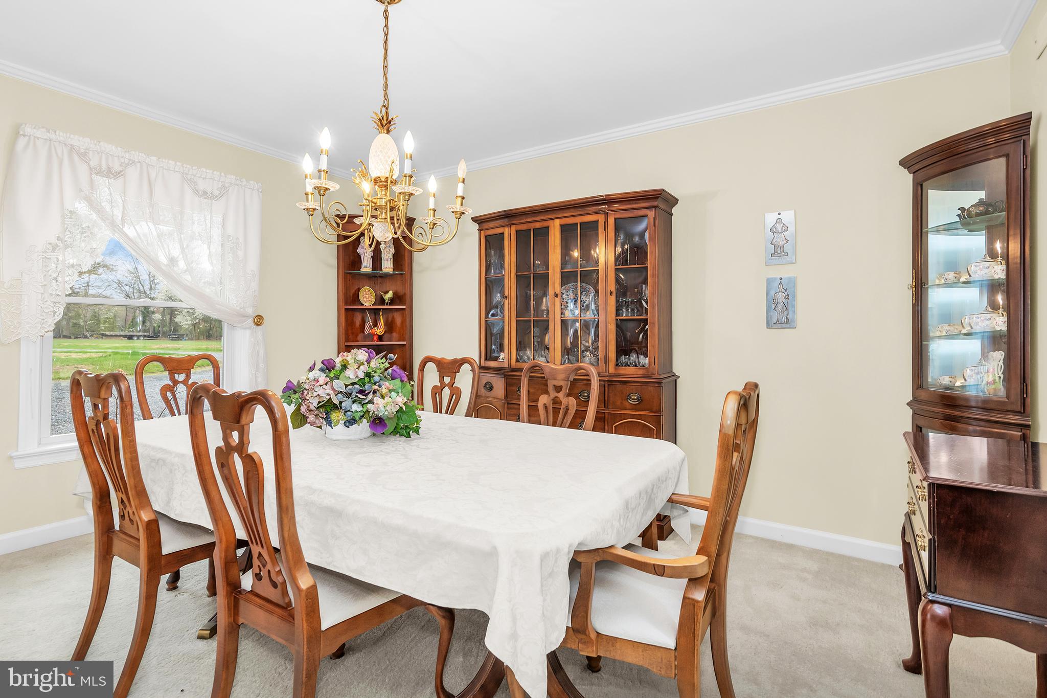 4752 Sailors Retreat Road Oxford, MD 21654 - Photo 19 of 22 a view of a dining room with furniture and window