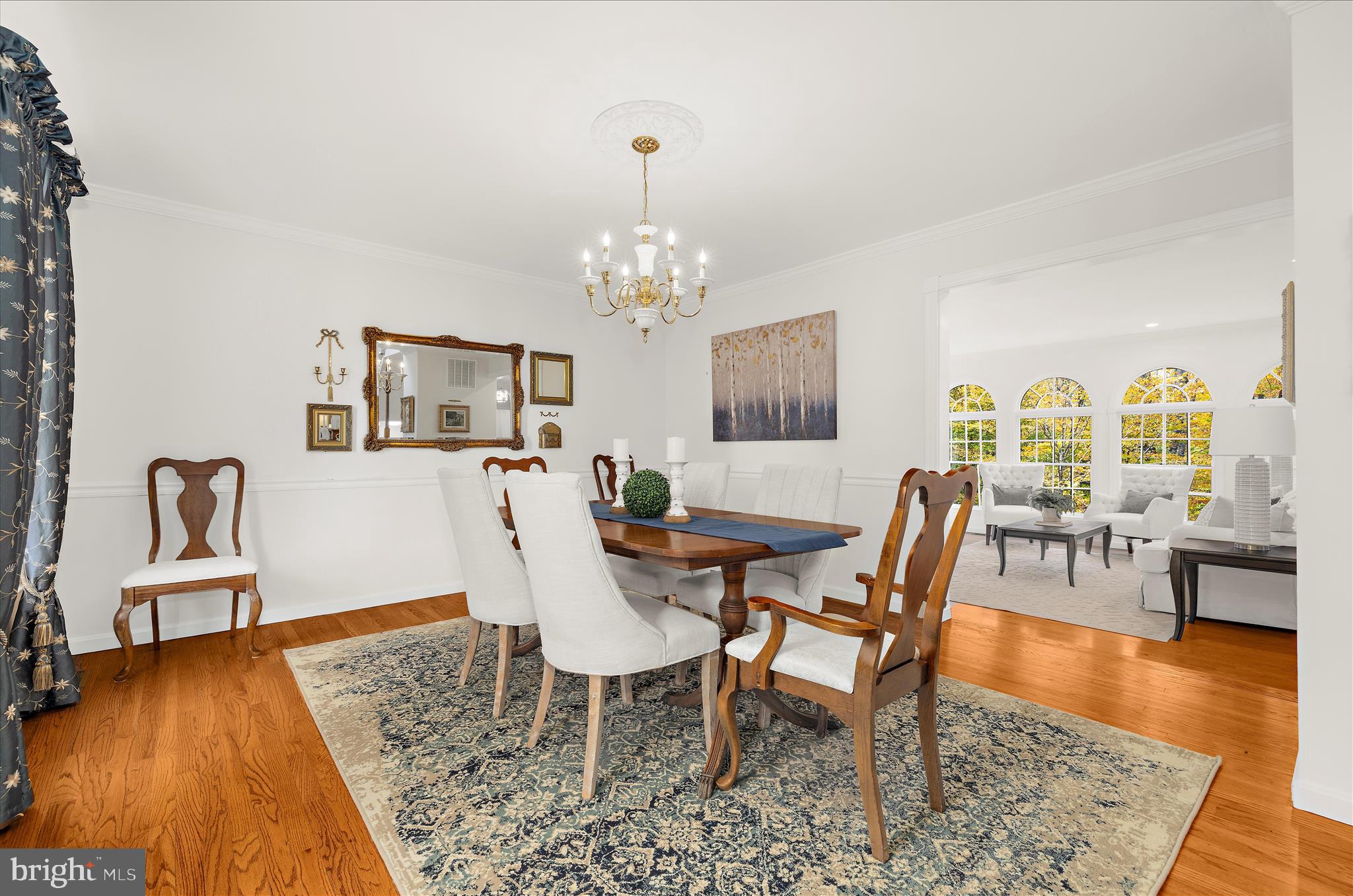 360 Hoile Lane Huntingtown, MD 20639 - Photo 30 of 96 a view of a dining room with furniture a chandelier and wooden floor