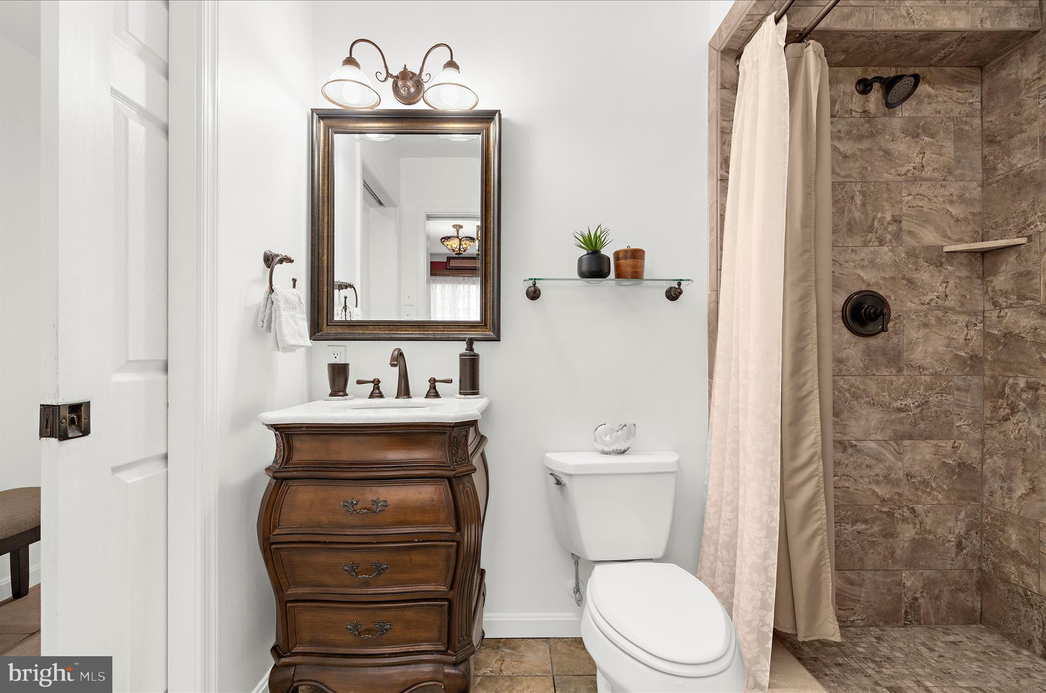 360 Hoile Lane Huntingtown, MD 20639 - Photo 35 of 96 a bathroom with a sink a toilet and shower