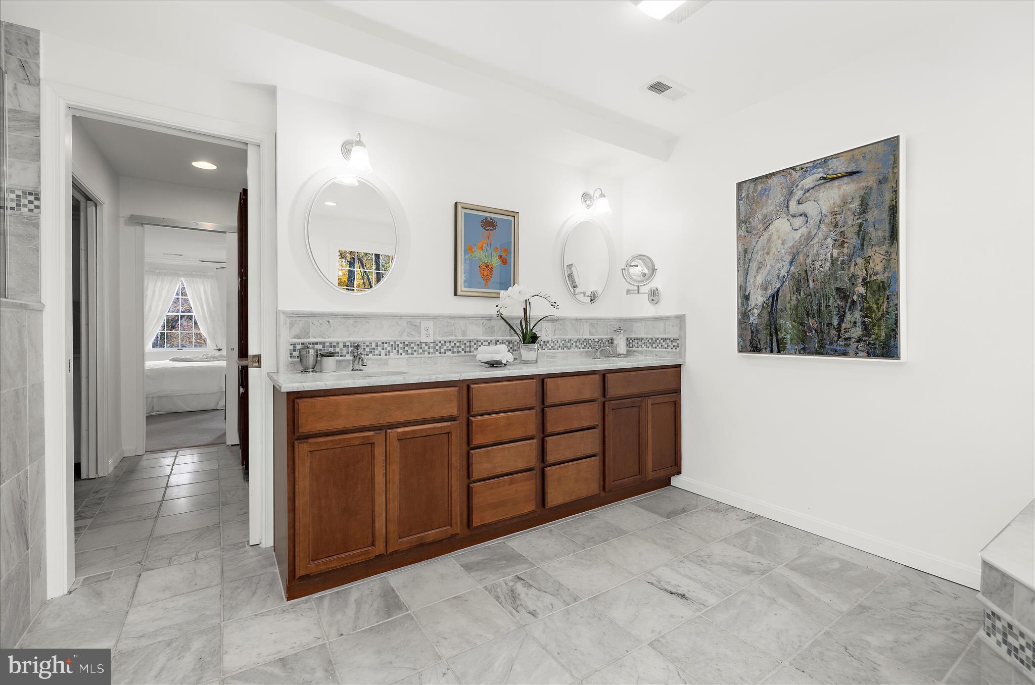 360 Hoile Lane Huntingtown, MD 20639 - Photo 45 of 96 a spacious bathroom with a granite countertop sink and a mirror