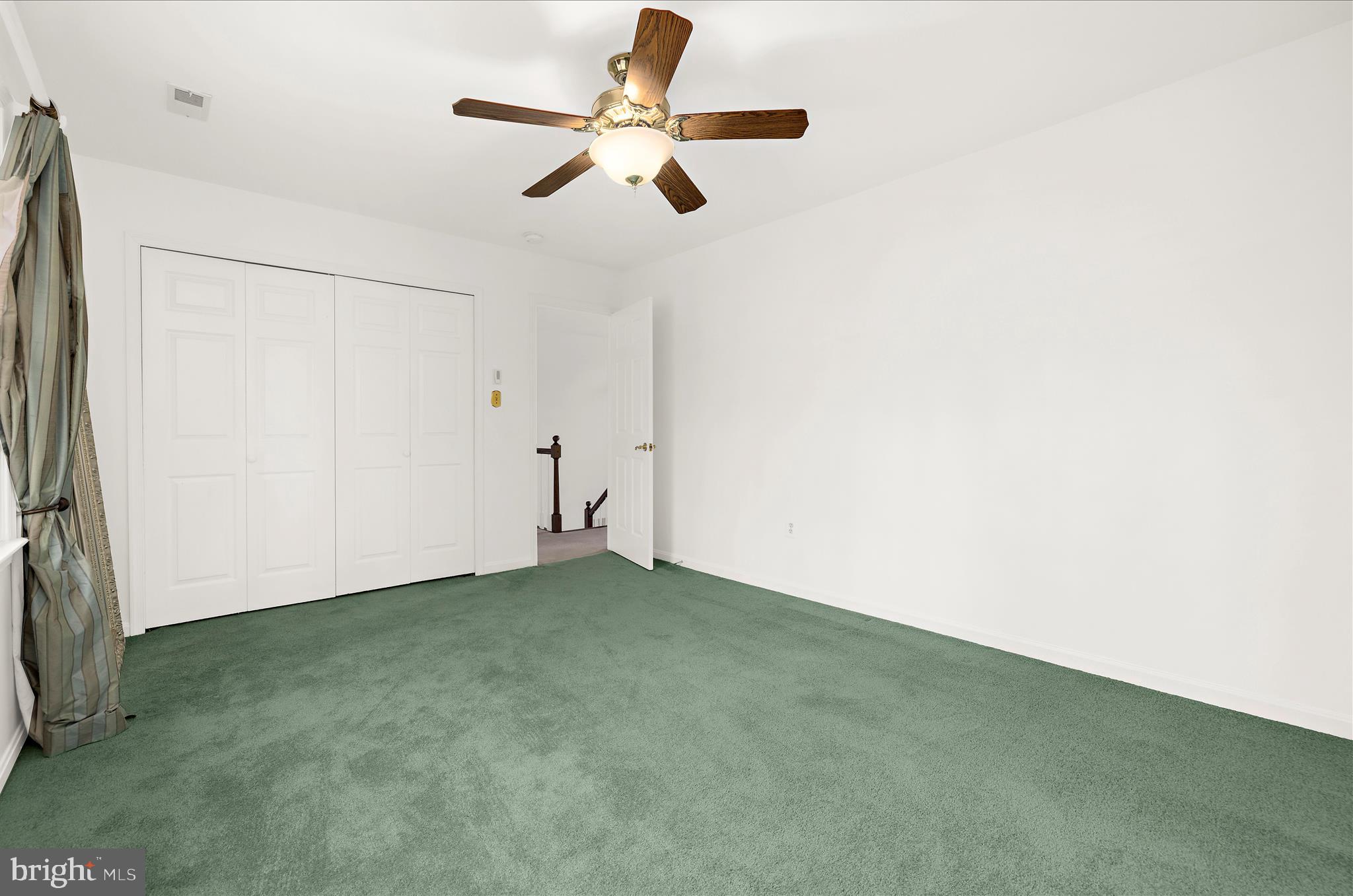 360 Hoile Lane Huntingtown, MD 20639 - Photo 54 of 96 an empty room with a ceiling fan and a window