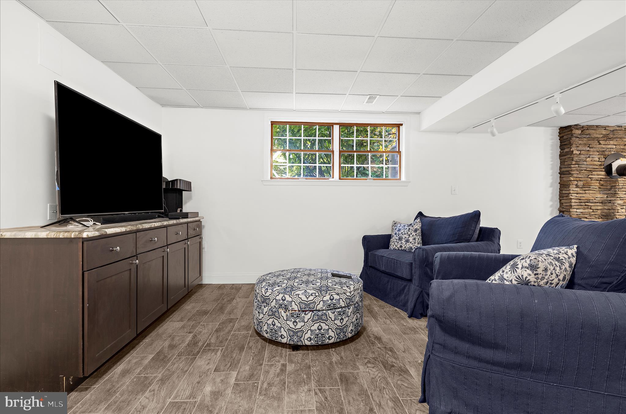 360 Hoile Lane Huntingtown, MD 20639 - Photo 60 of 96 a living room with furniture and a flat screen tv