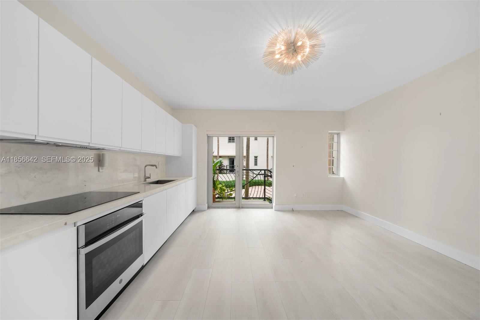 a large kitchen with a large window