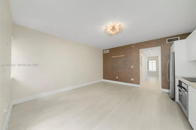 a view of a kitchen with a sink and a stove