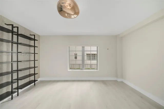 an empty room with a empty space and window