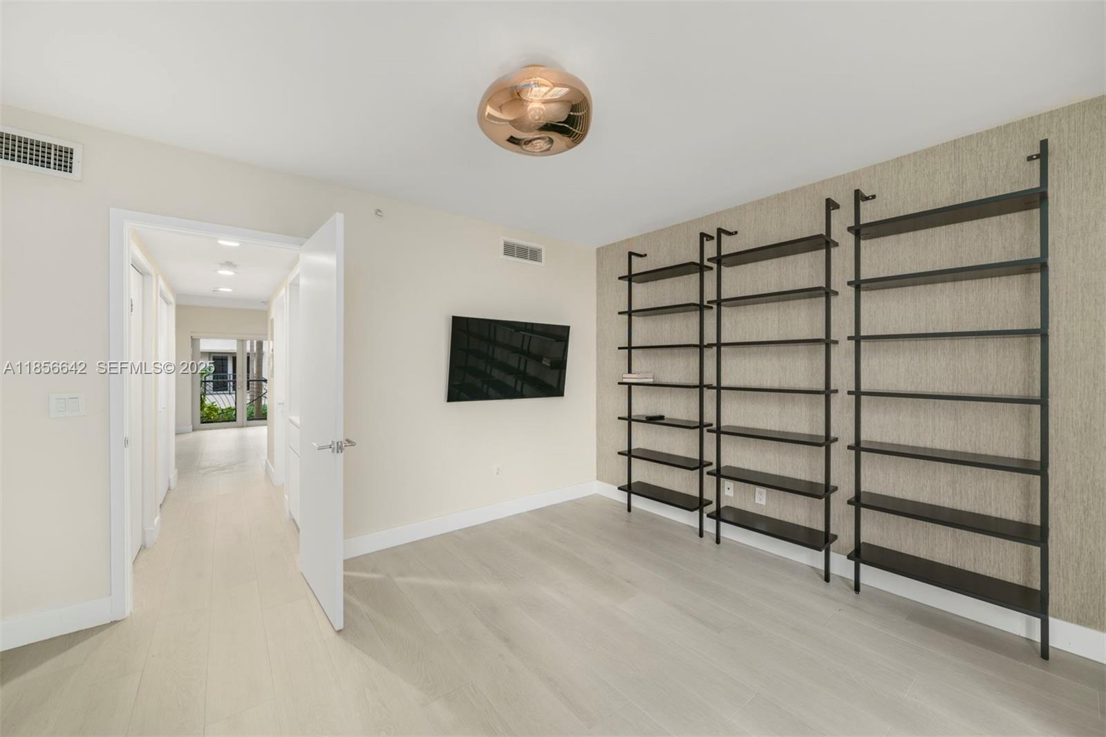 435 21st Street, Unit 103 Miami Beach, FL 33139 - Photo 6 of 20 a view of a livingroom with furniture and staircase