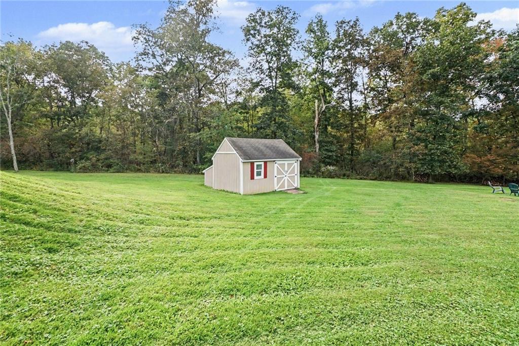315 Fassinger Road Evans City, PA 16033 - Photo 29 of 32 Large shed that fits a large riding mower.
