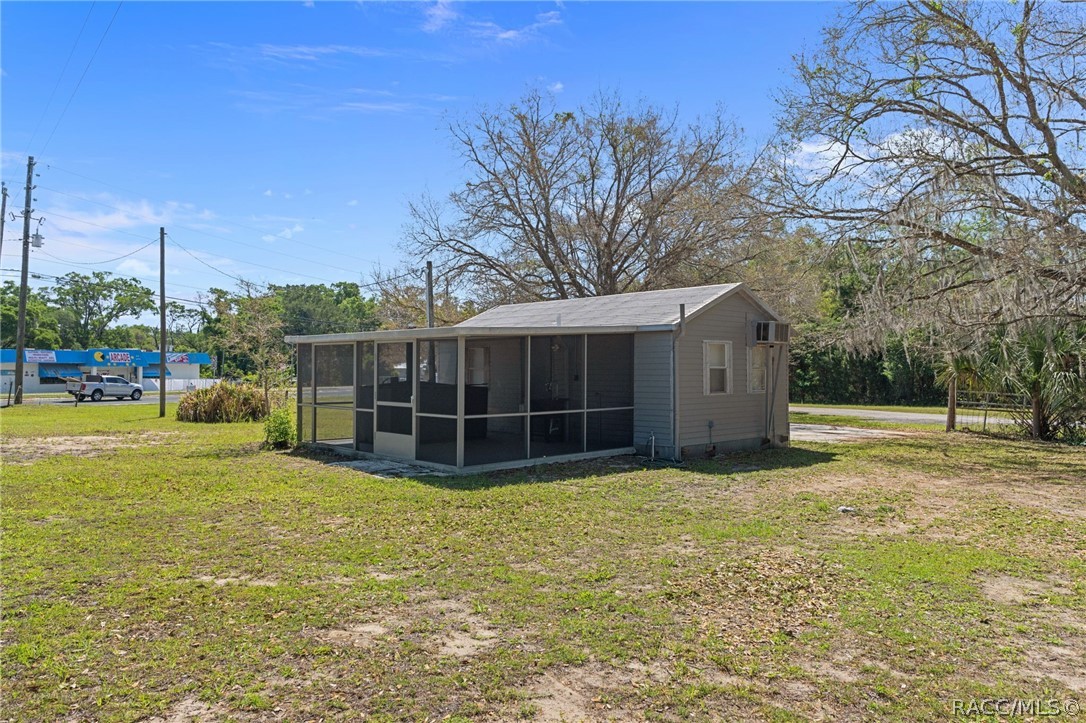 4530 South Florida Avenue Inverness, FL 34450 - Photo 49 of 100 a view of a house with a yard and garage
