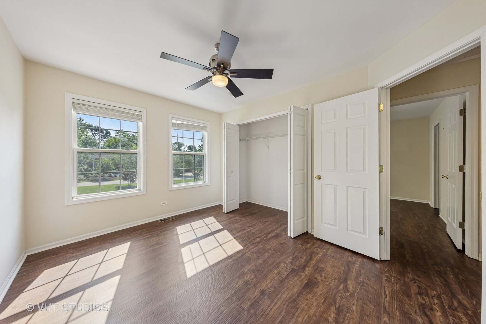 7324 Chestnut Hills Drive Burr Ridge, IL 60527 - Photo 17 of 25 a view of empty room with wooden floor and fan