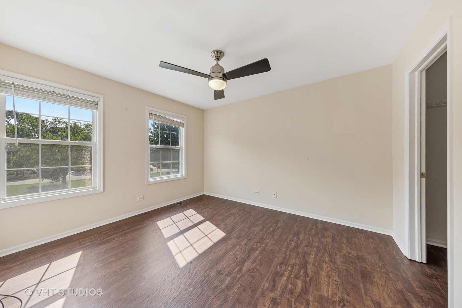 7324 Chestnut Hills Drive Burr Ridge, IL 60527 - Photo 18 of 25 a view of empty room with wooden floor and fan