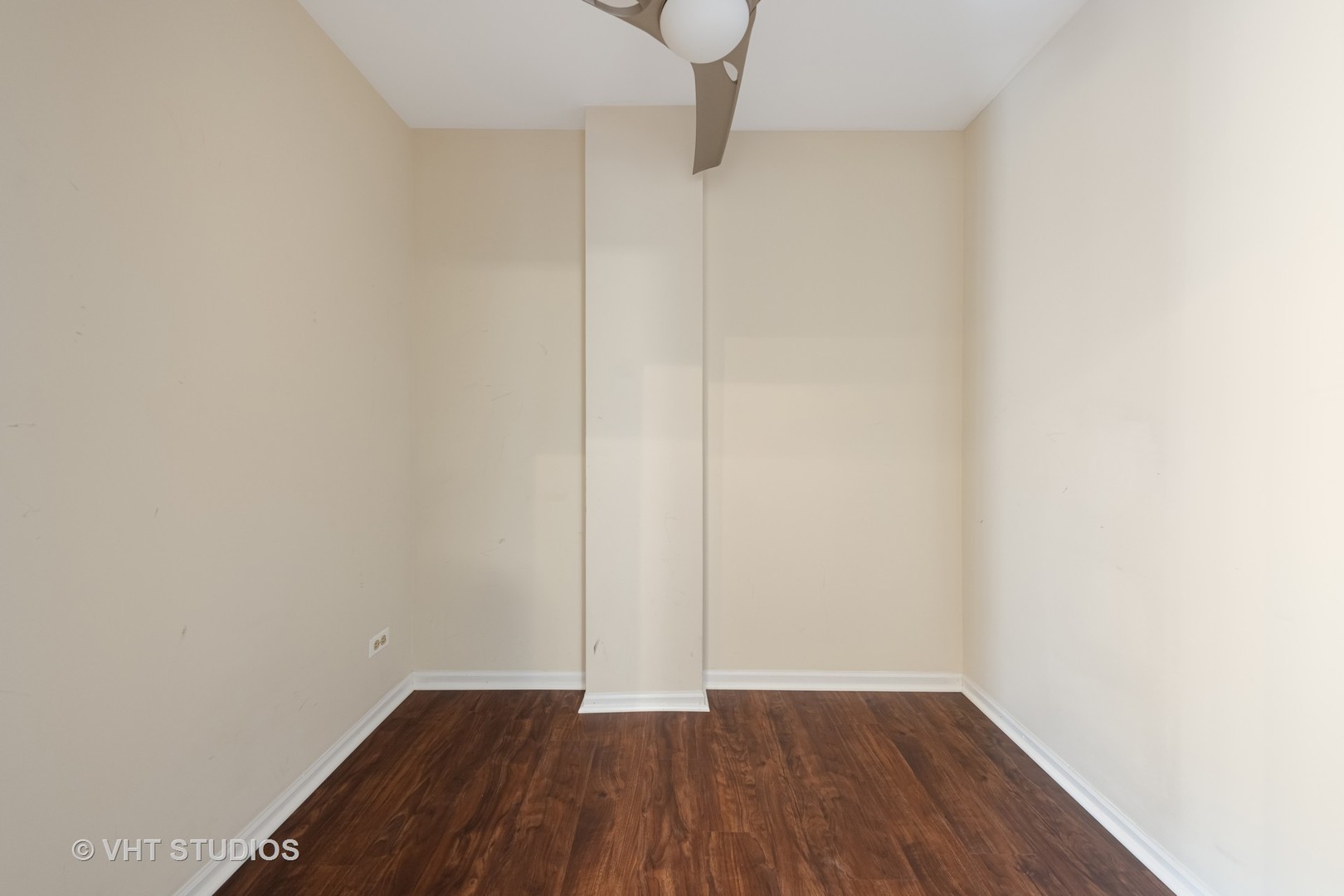 7324 Chestnut Hills Drive Burr Ridge, IL 60527 - Photo 19 of 25 a view of an empty room with wooden floor and a window