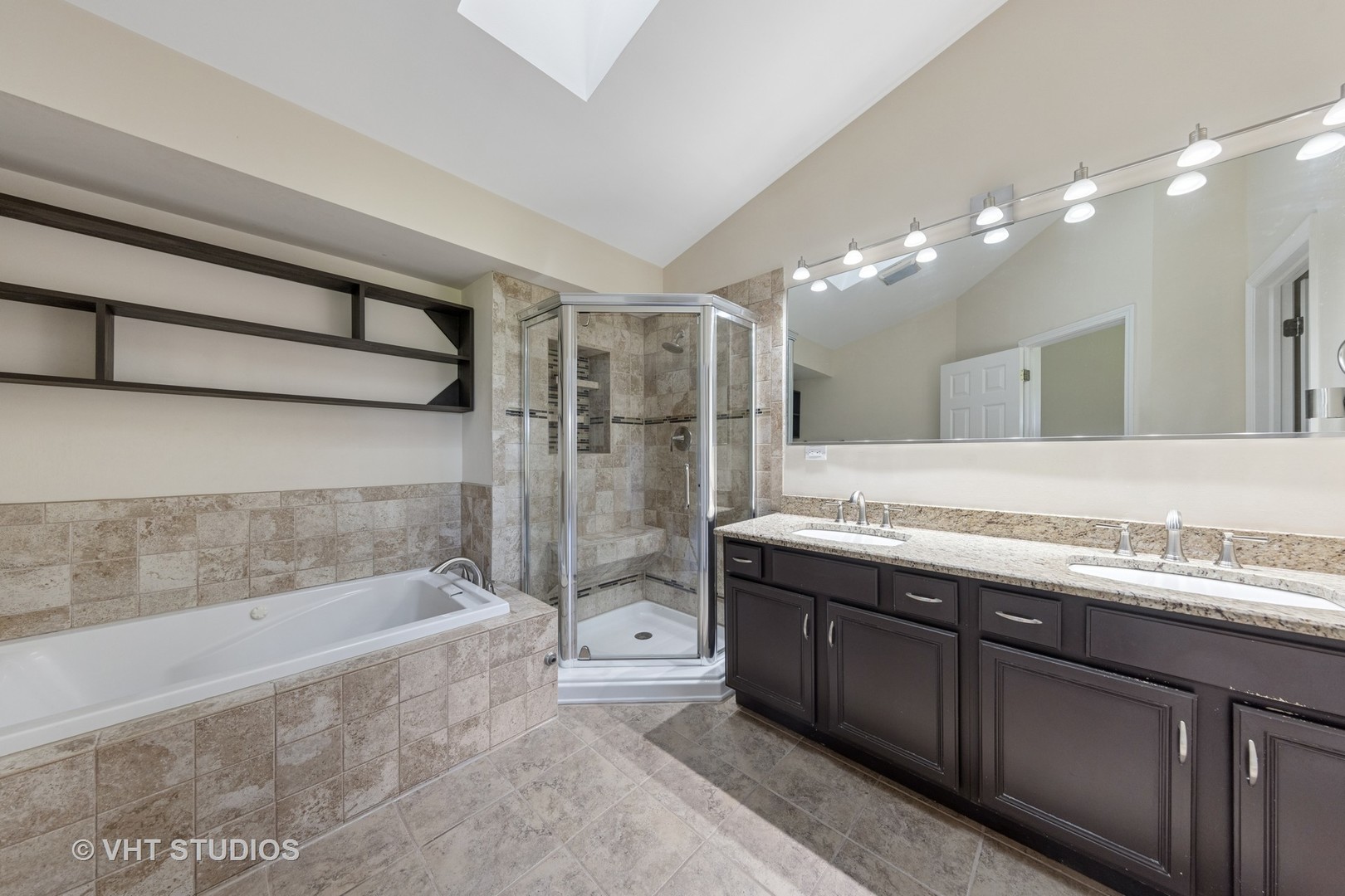 7324 Chestnut Hills Drive Burr Ridge, IL 60527 - Photo 22 of 25 a bathroom with a bathtub a double vanity sink and a shower