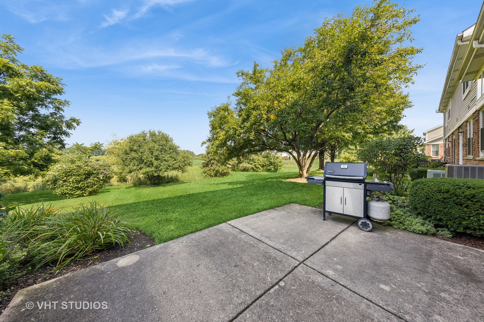 7324 Chestnut Hills Drive Burr Ridge, IL 60527 - Photo 24 of 25 a view of a garden with a bench