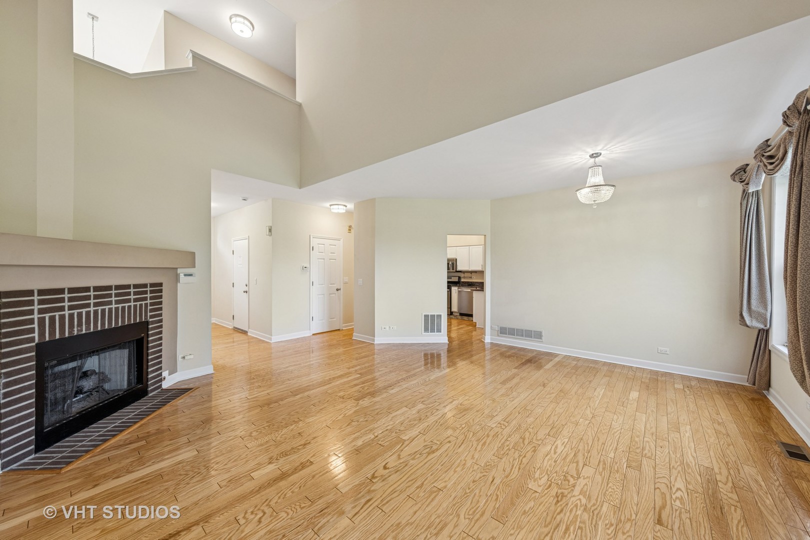 7324 Chestnut Hills Drive Burr Ridge, IL 60527 - Photo 5 of 25 a view of empty room with wooden floor and fireplace