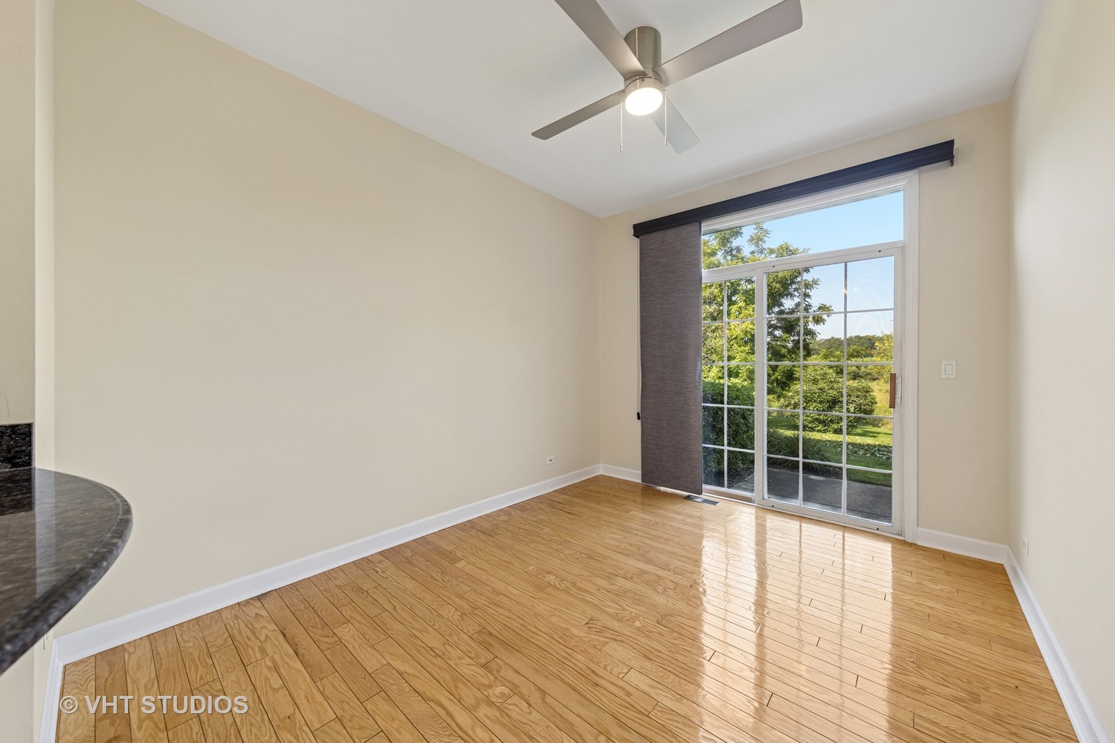 7324 Chestnut Hills Drive Burr Ridge, IL 60527 - Photo 6 of 25 a view of an empty room with wooden floor and a window