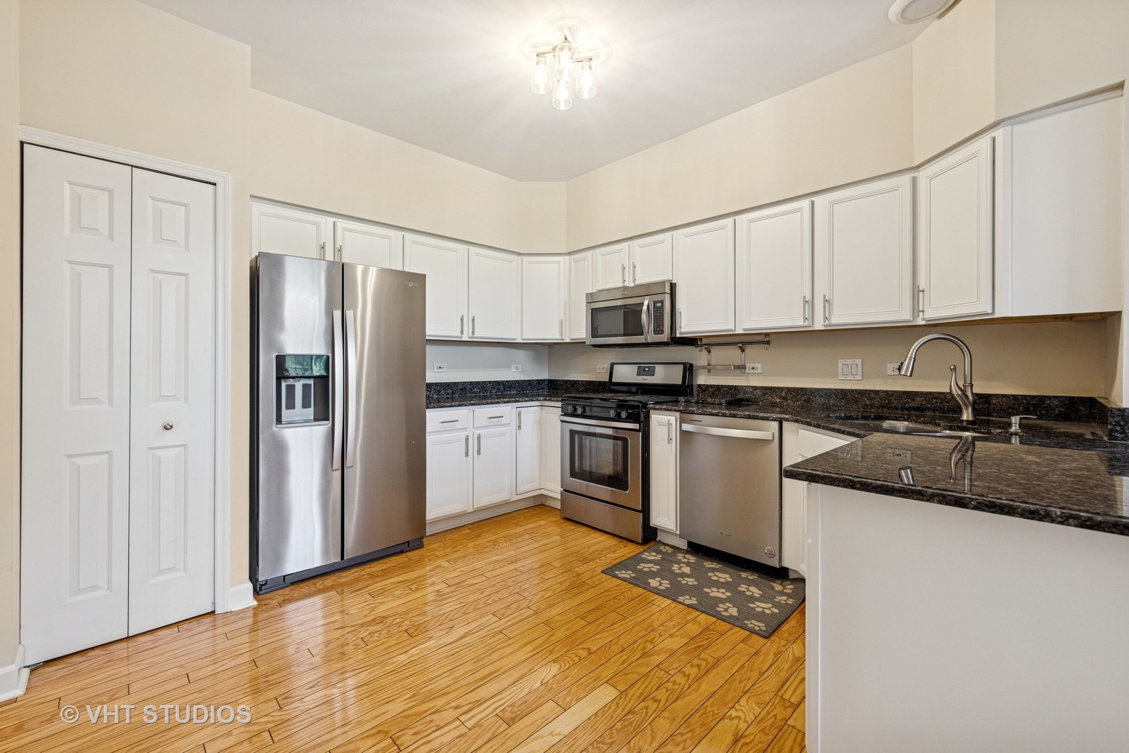 7324 Chestnut Hills Drive Burr Ridge, IL 60527 - Photo 8 of 25 a kitchen with stainless steel appliances granite countertop a refrigerator sink and white cabinets
