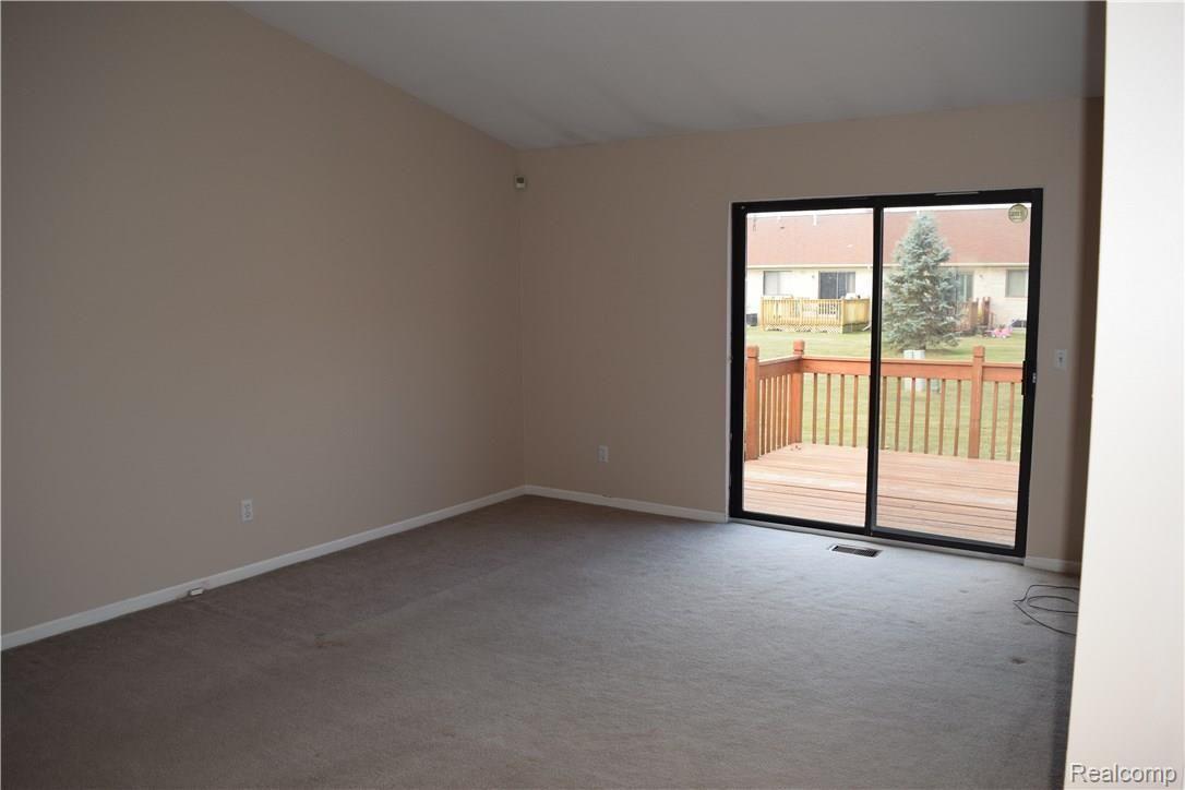 57627 Jewell Road Washington, MI 48094 - Photo 12 of 24 Living Room with Doorwall to patio desck
