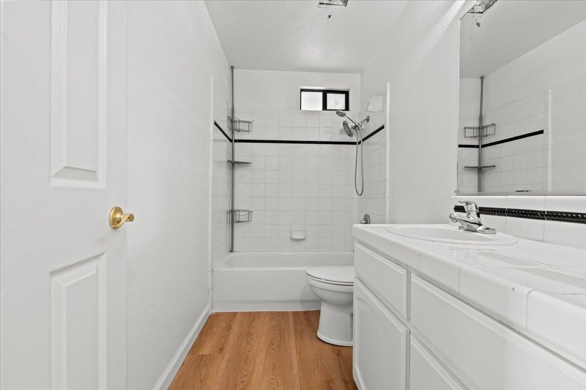 938 Snowgoose Lane Manteca, CA 95337 - Photo 13 of 16 a bathroom with a sink a toilet and shower