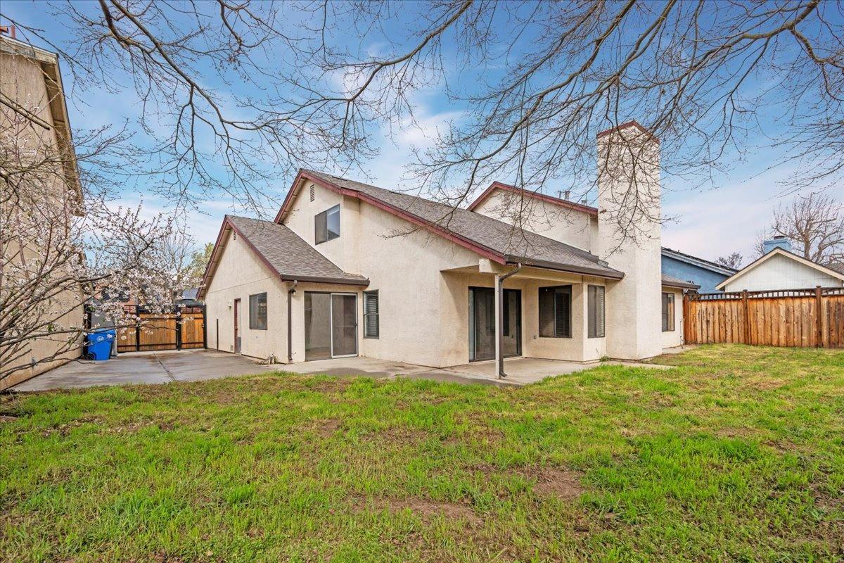 938 Snowgoose Lane Manteca, CA 95337 - Photo 15 of 16 a front view of house with yard and seating area