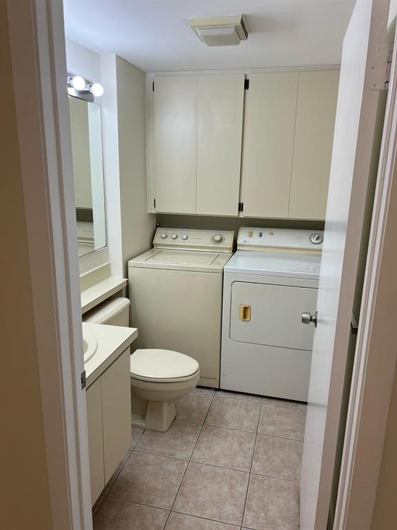 849 Blue Ridge Circle West Palm Beach, FL 33409 - Photo 22 of 28 a bathroom with a granite countertop toilet and a sink
