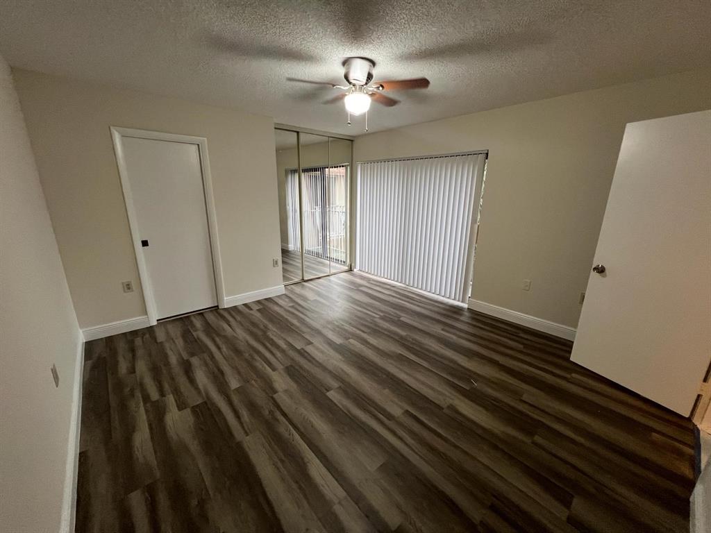 849 Blue Ridge Circle West Palm Beach, FL 33409 - Photo 5 of 28 a view of empty room with wooden floor