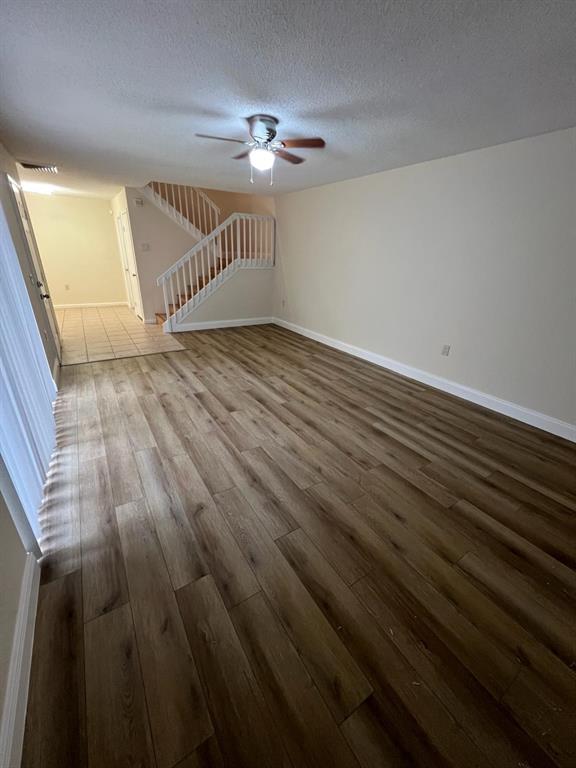 849 Blue Ridge Circle West Palm Beach, FL 33409 - Photo 10 of 28 wooden floor in an empty room with a window