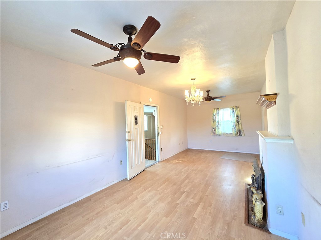 2789 Fairmount Boulevard Riverside, CA 92501 - Photo 21 of 74 a view of a livingroom with a ceiling fan and window