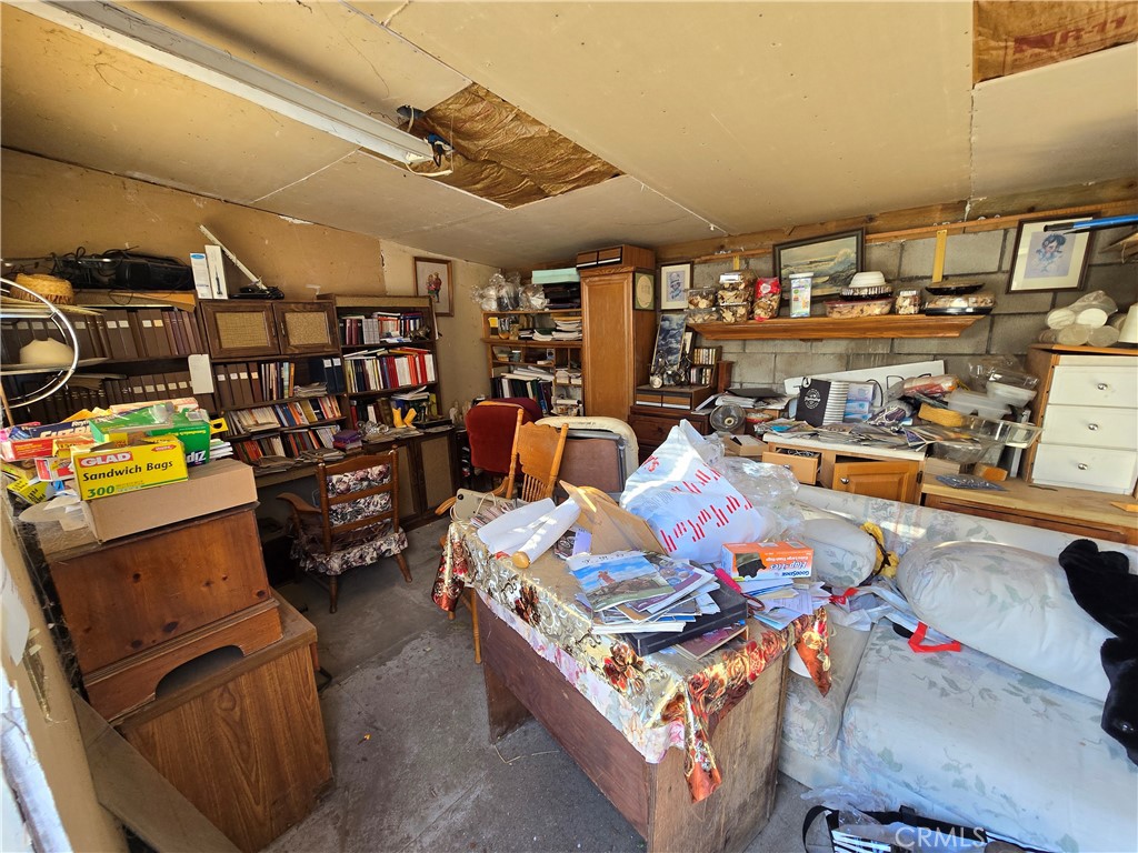 2789 Fairmount Boulevard Riverside, CA 92501 - Photo 43 of 74 a living room with lots of furniture and clutter