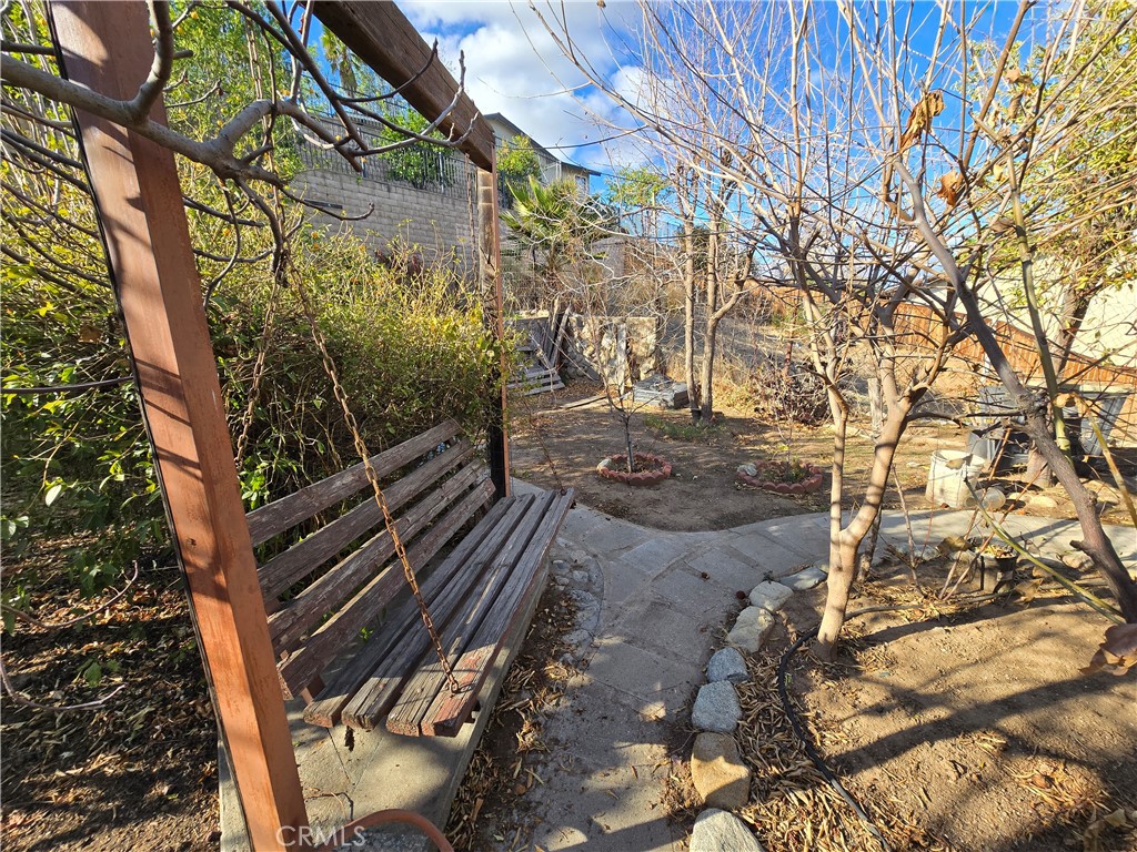 2789 Fairmount Boulevard Riverside, CA 92501 - Photo 61 of 74 a view of a yard with plants and a large tree