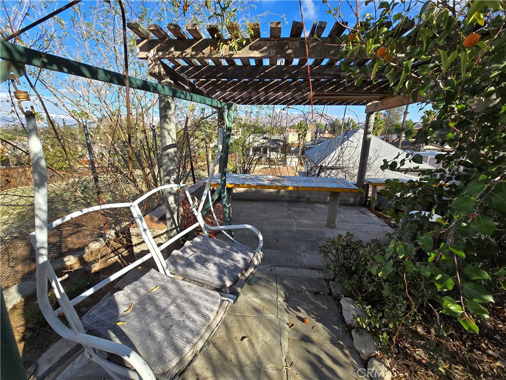2789 Fairmount Boulevard Riverside, CA 92501 - Photo 63 of 74 a view of a patio with table and chairs a barbeque with potted plants