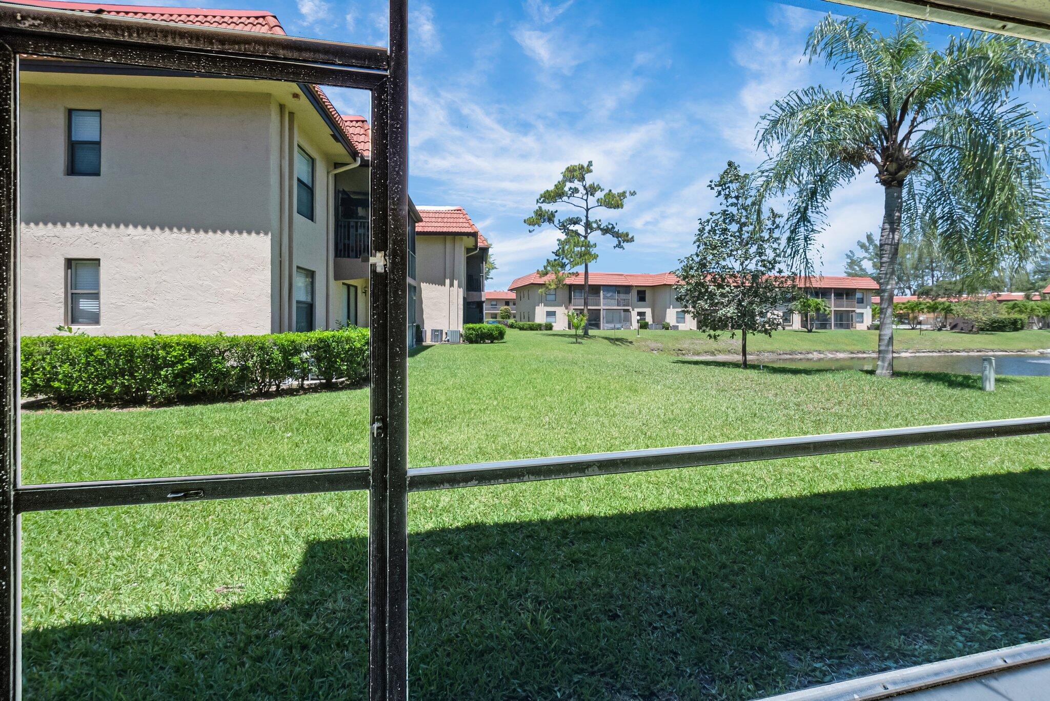 21911 Lake Forest Circle, Unit 103 Boca Raton, FL 33433 - Photo 16 of 24 Patio onto lake view 2