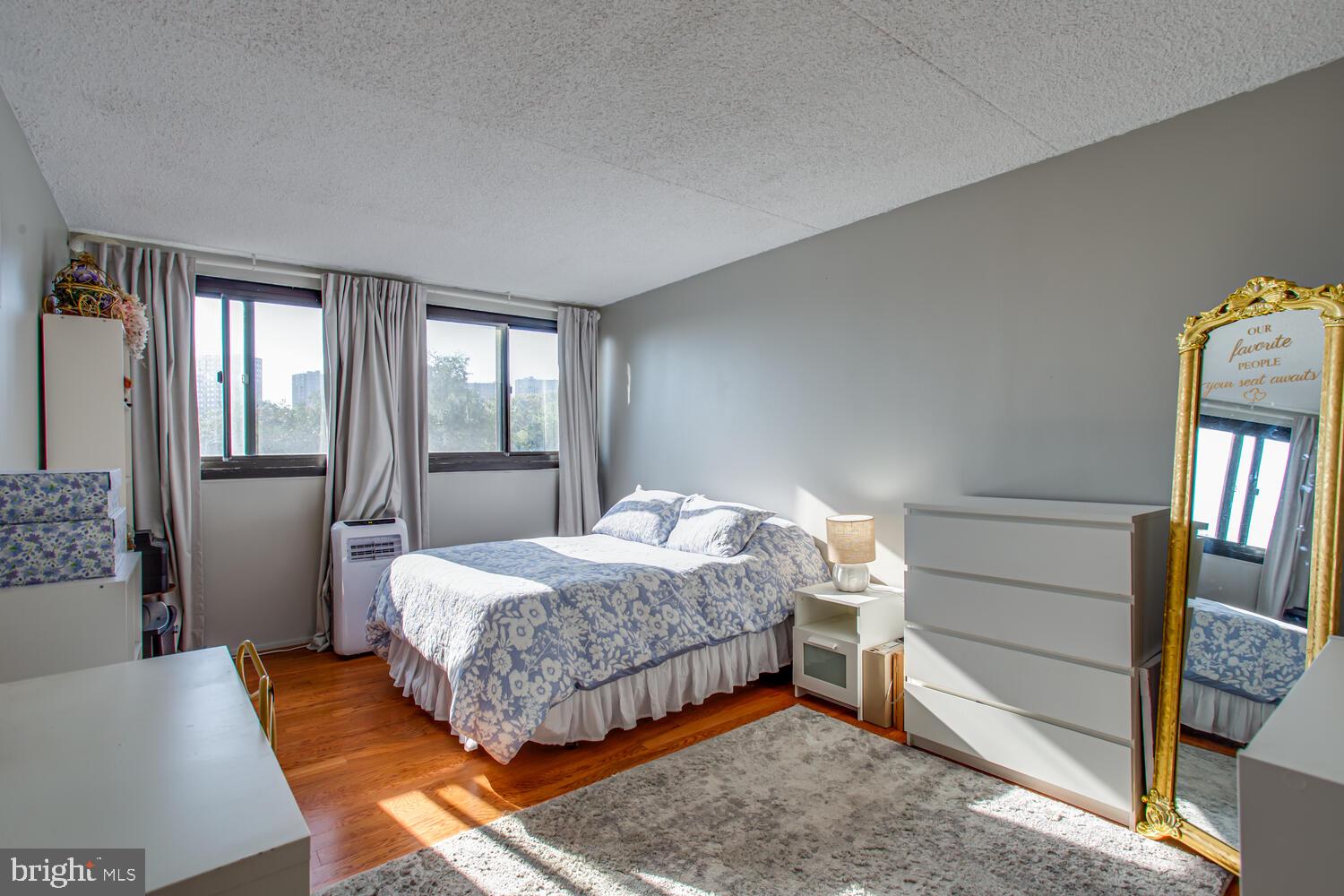 5911 Edsall Road, Unit 206 Alexandria, VA 22304 - Photo 12 of 40 a bedroom with a bed and a dresser