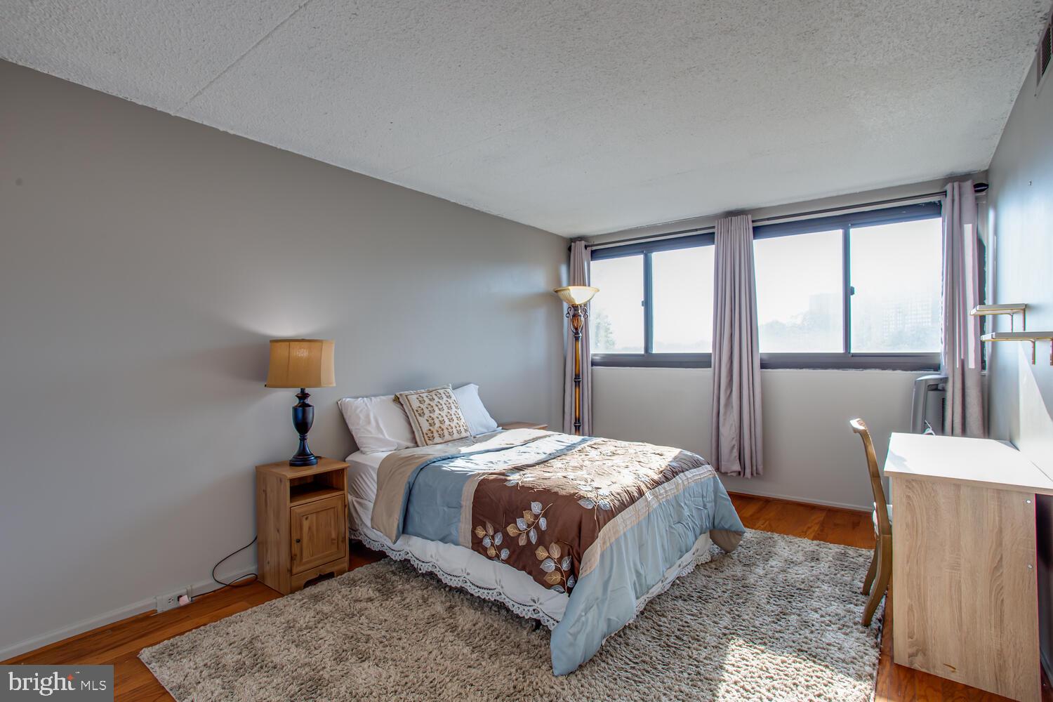 5911 Edsall Road, Unit 206 Alexandria, VA 22304 - Photo 14 of 40 a bedroom with a bed and a window