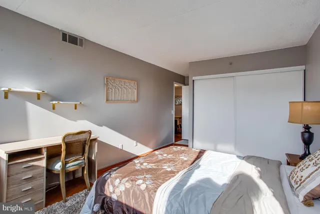 a bedroom with a bed and a tv in it