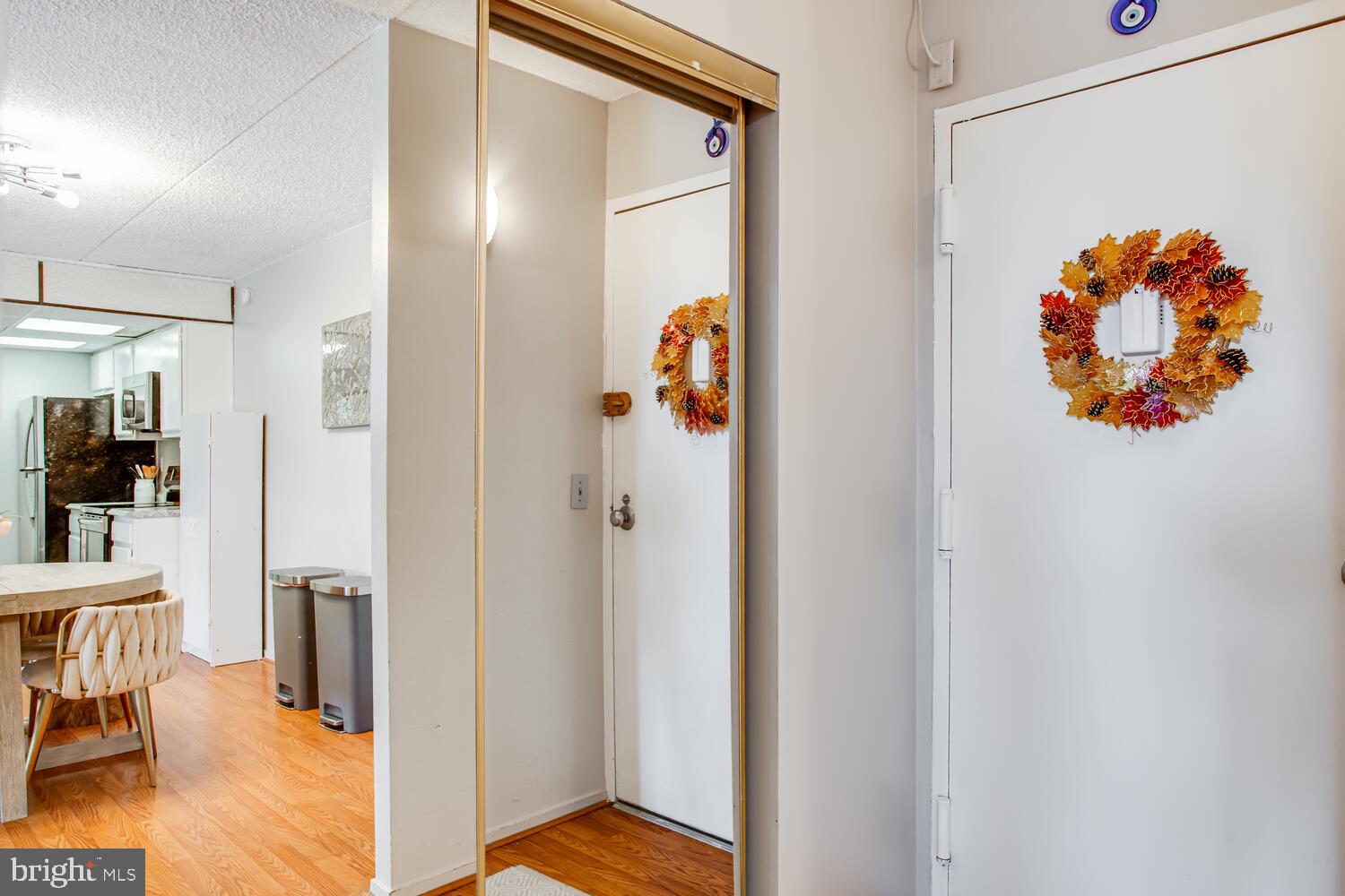 5911 Edsall Road, Unit 206 Alexandria, VA 22304 - Photo 18 of 40 a view of a hallway with dining area and glass door