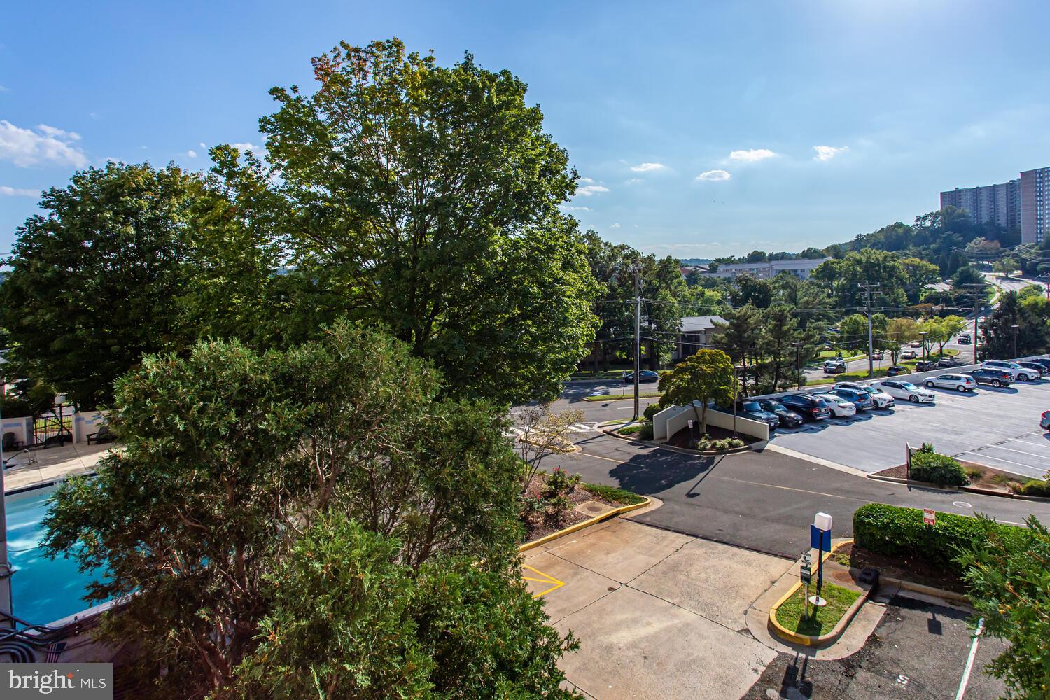 5911 Edsall Road, Unit 206 Alexandria, VA 22304 - Photo 31 of 40 a view of a chair and tables in the patio