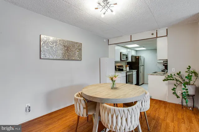 a kitchen with a table and chairs