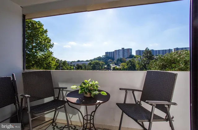 a view of an chairs and table in patio