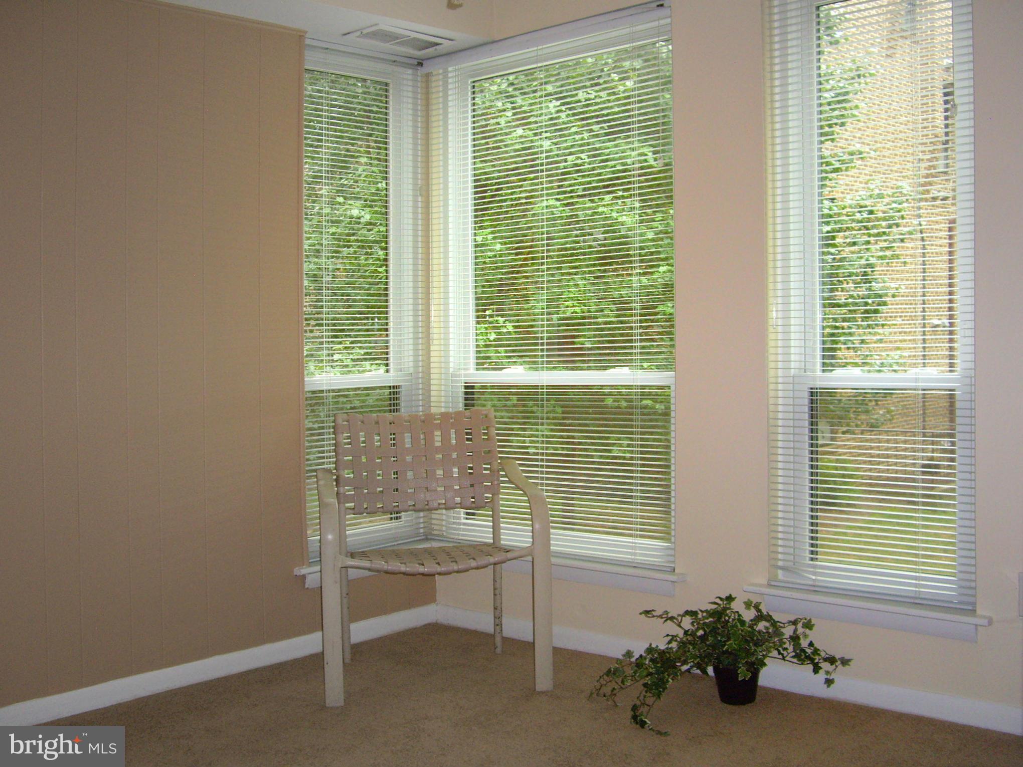 11212 Chestnut Grove Square, Unit 114 Reston, VA 20190 - Photo 13 of 18 a room with a window
